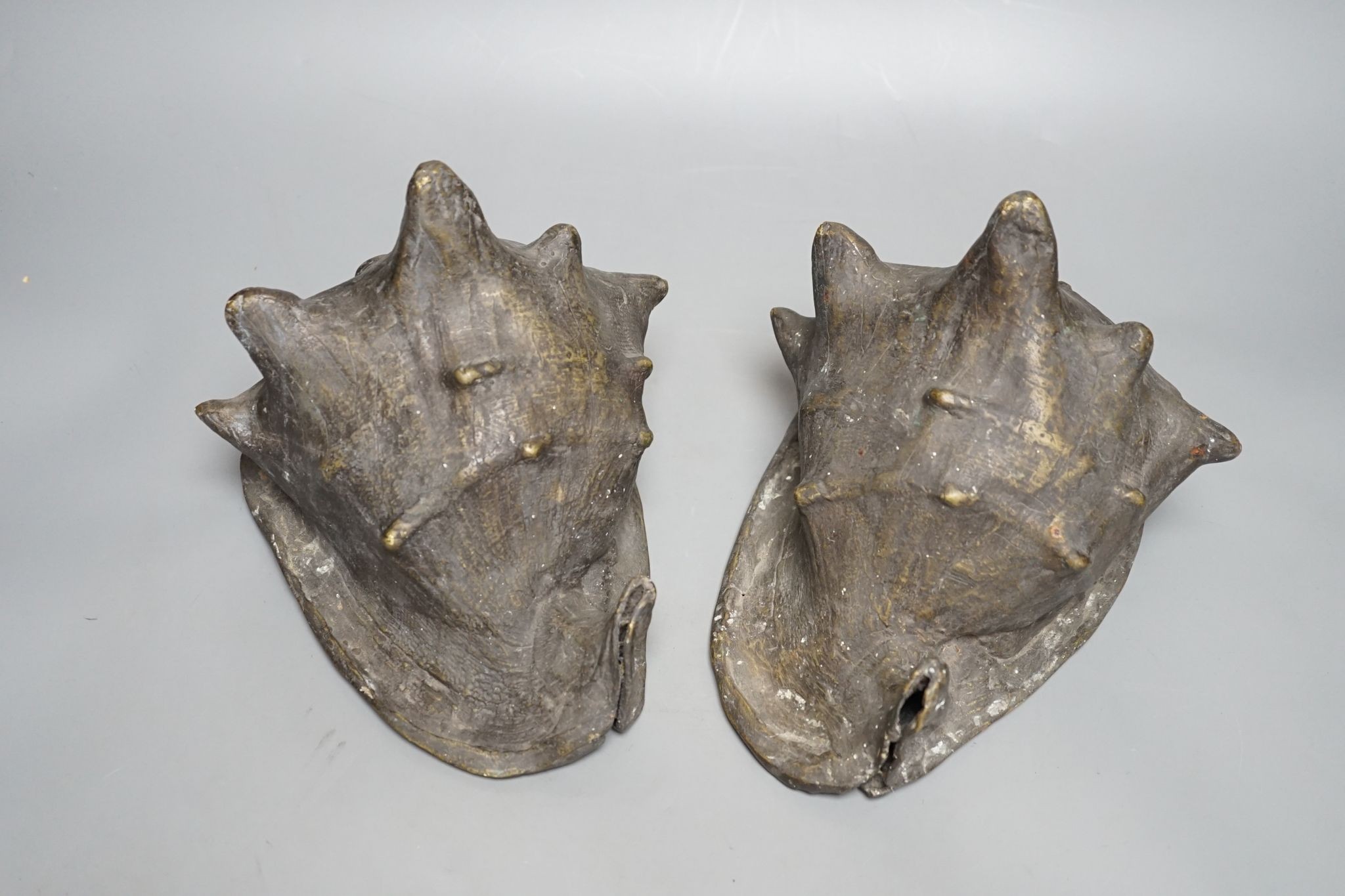 A pair of spelter conch shells, 24cm